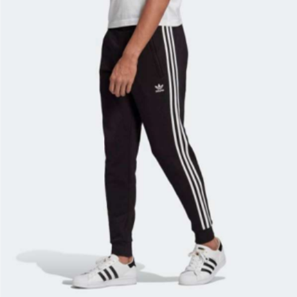 A person wearing black pants with white stripes

Description automatically generated