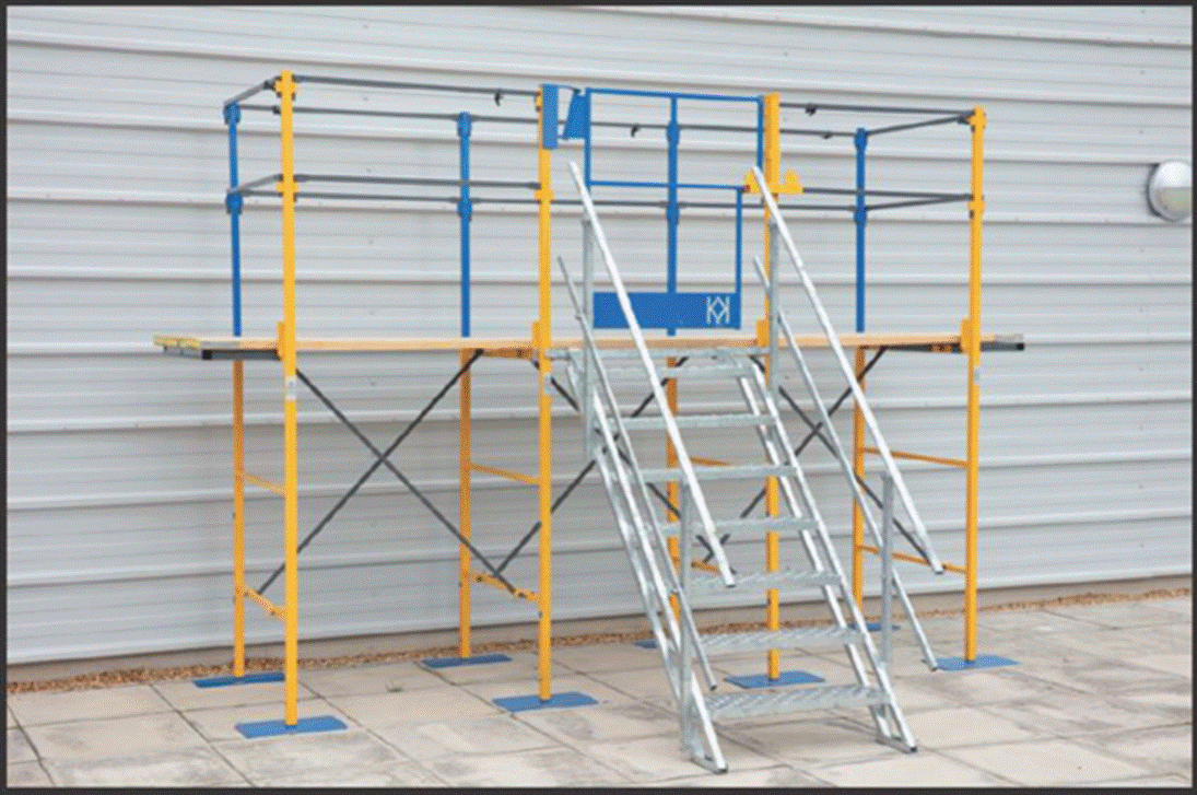 A photograph of blue and yellow scaffolding with metal stairs